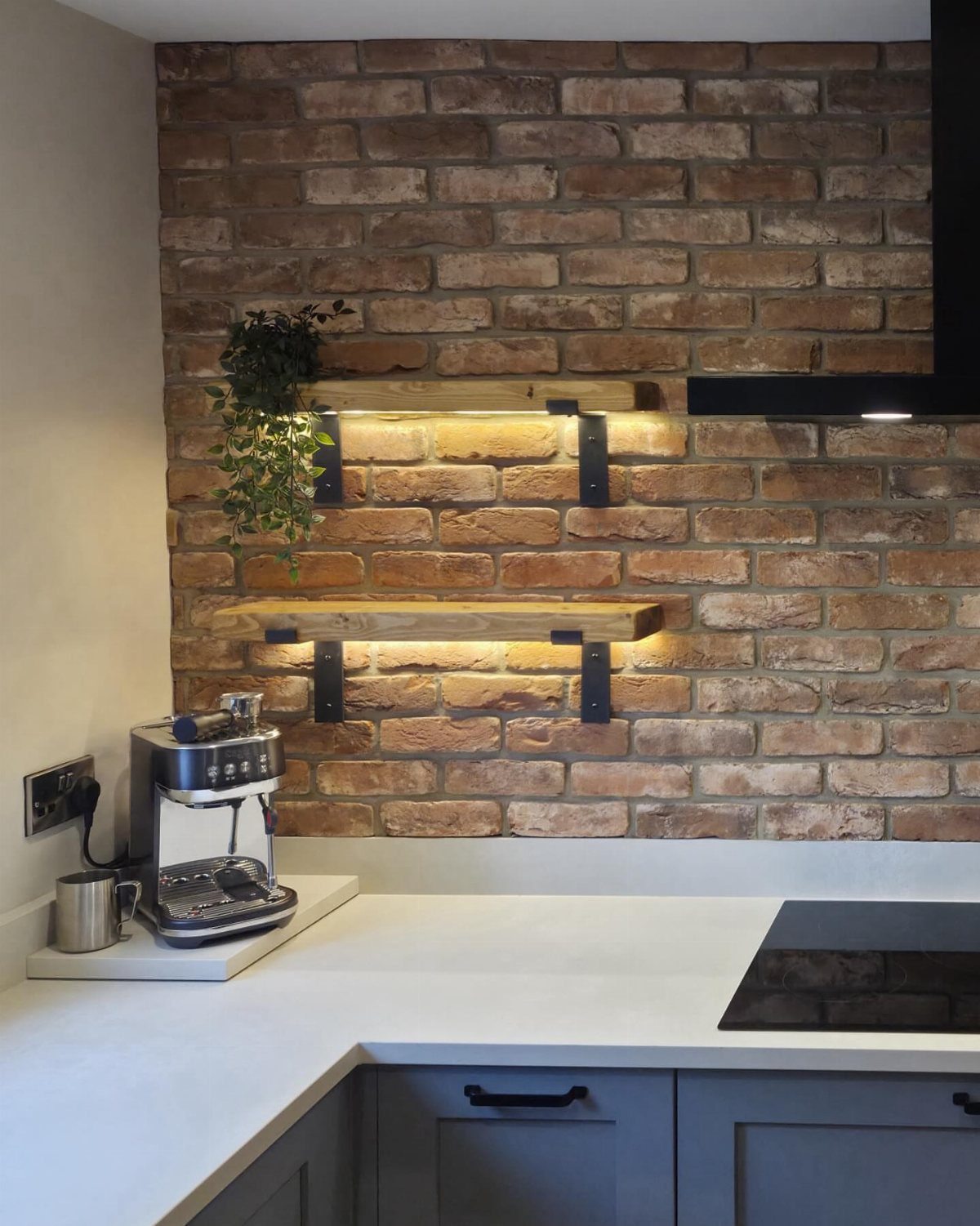 22 Apt Kitchen Ideas to Maximize Style and Function 13 Wooden floating shelves with lighting on a red brick kitchen wall
