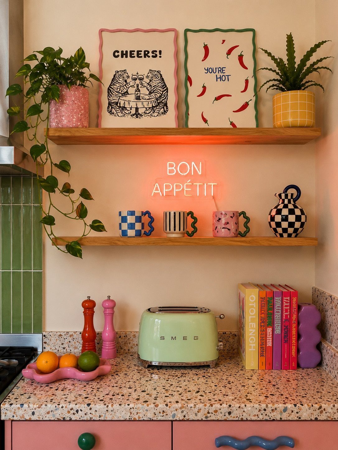 22 Apt Kitchen Ideas to Maximize Style and Function 21 Colorful kitchen counter with a light green toaster and neon Bon Appétit sign.