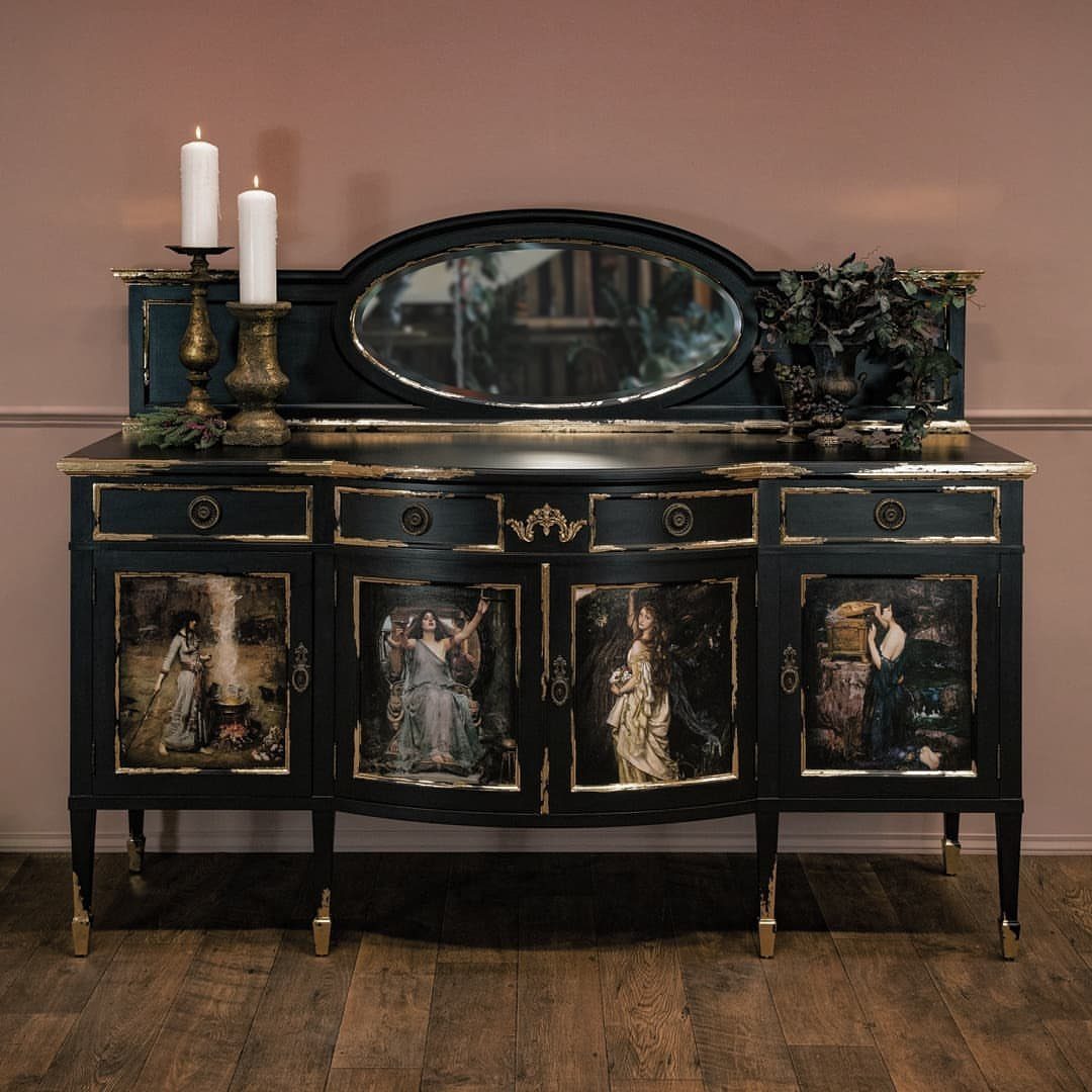 Black painted sideboard with gold trim and classical figure paintings on wooden floors.