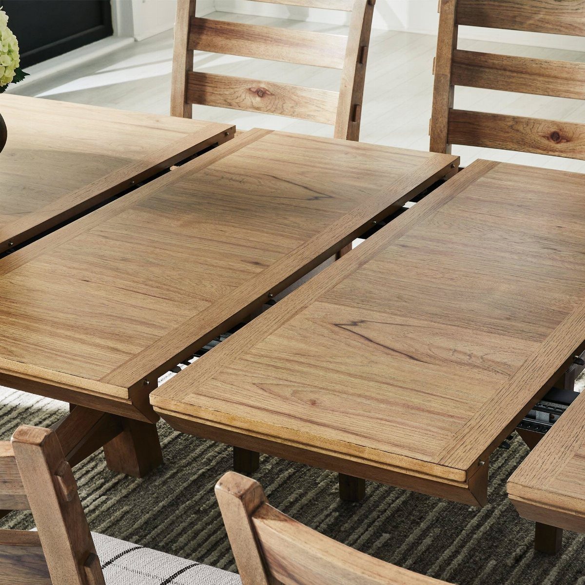 Extendable Kitchen Table Designs: 16 Ideas with Photos 7 Light wood farmhouse extension table with separated leaves and matching wooden chairs.