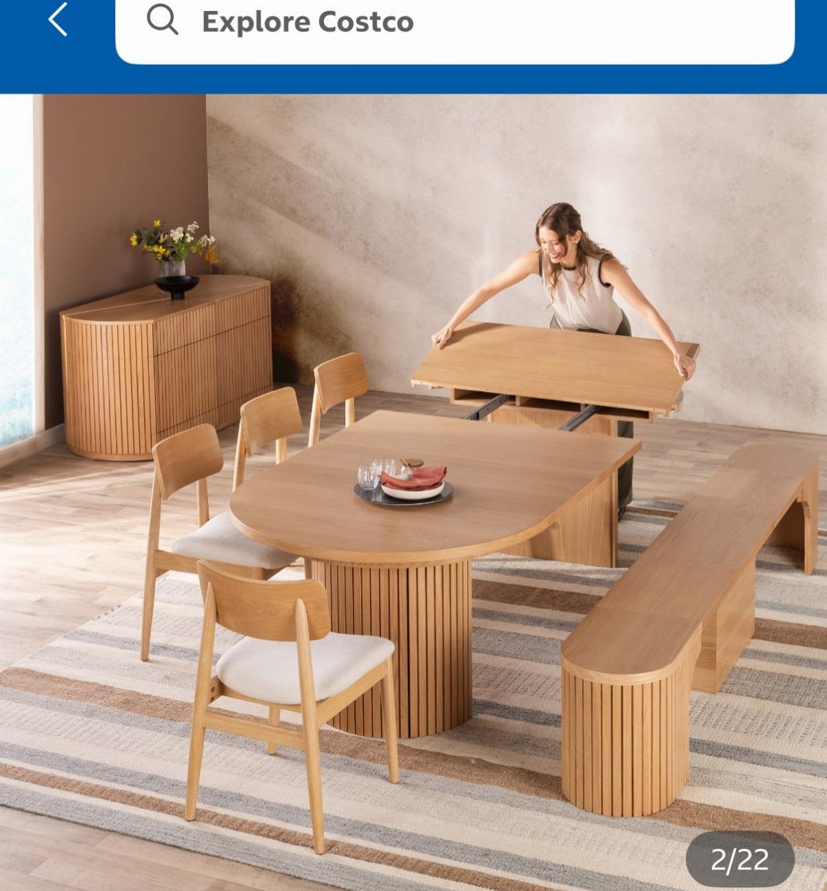 Extendable Kitchen Table Designs: 16 Ideas with Photos 17 Woman extending a light wood dining table with matching chairs and a bench.
