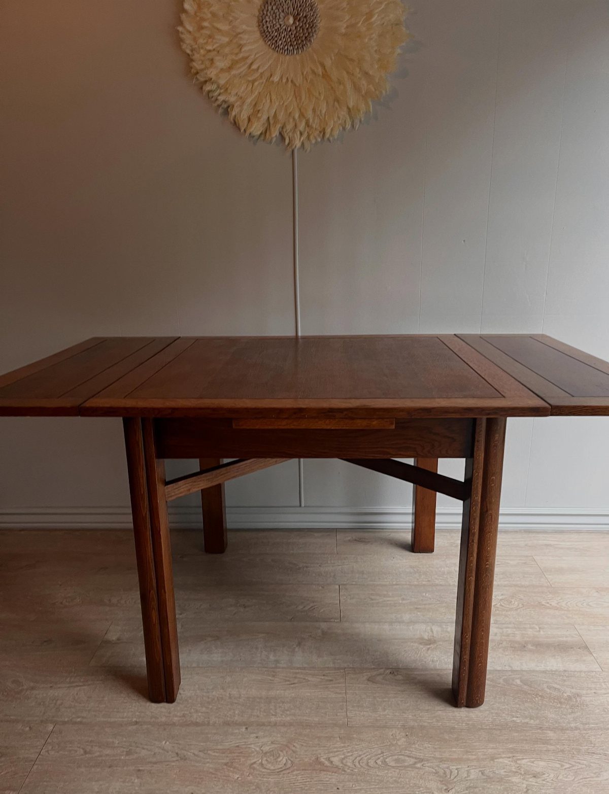 Extendable Kitchen Table Designs: 16 Ideas with Photos 8 Wooden oak extension table with side leaves extended in a minimalist room.