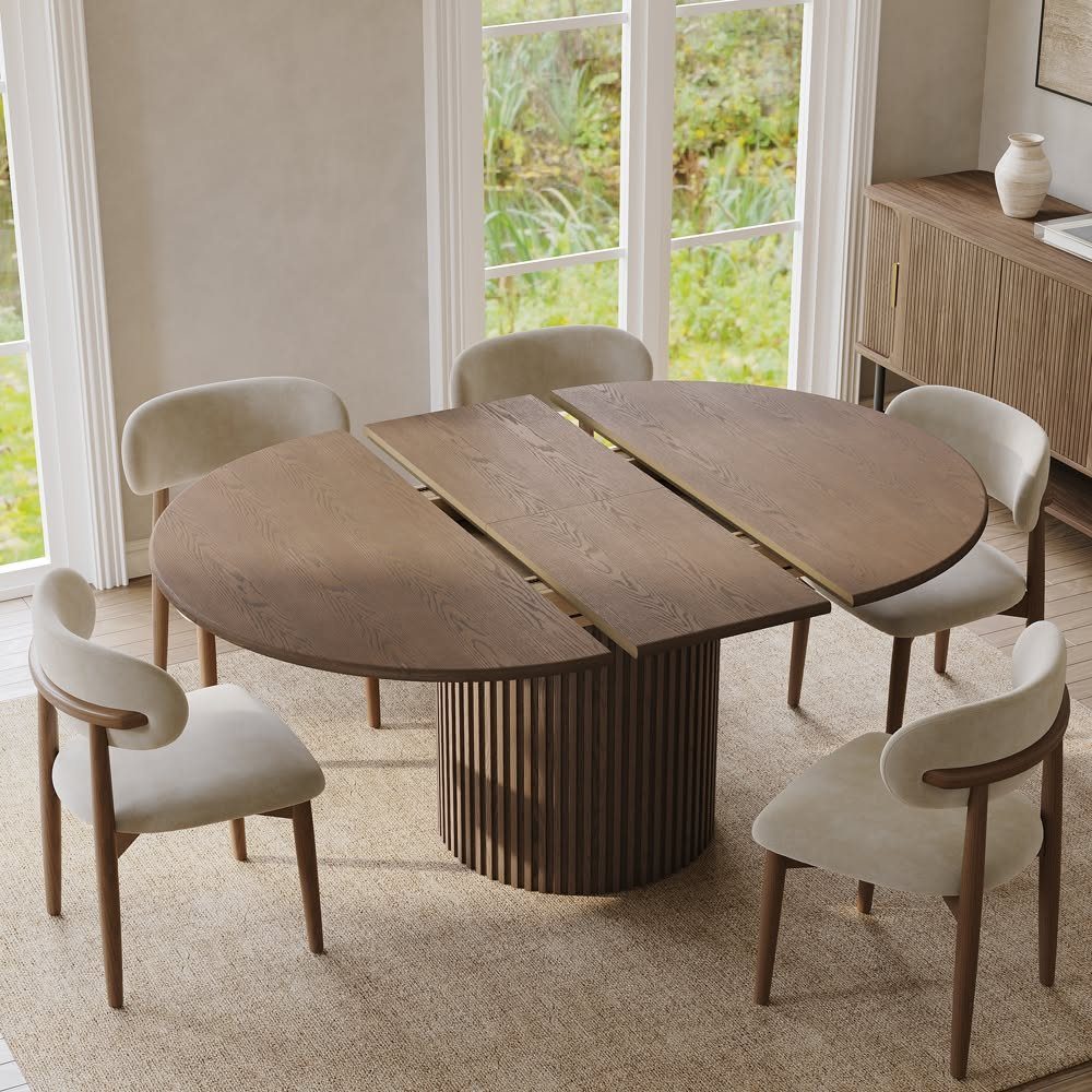 Extendable Kitchen Table Designs: 16 Ideas with Photos 10 Oval wooden dining table with a fluted pedestal base and an inserted extension leaf.