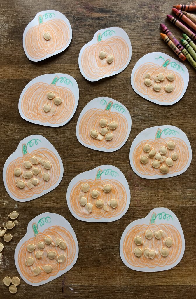 A sheet with hand-drawn pumpkins numbered 1 to 10 with seeds.