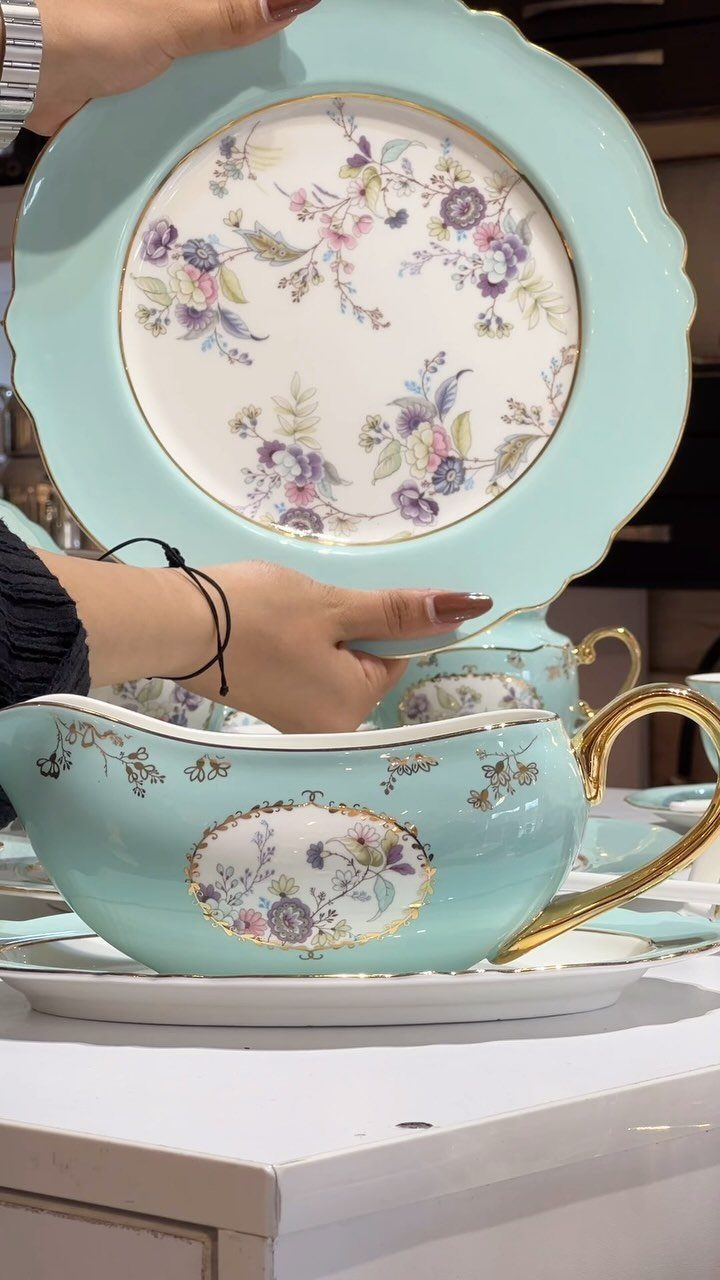 Fancy Dinnerware Set Ideas for 2026 Tables (28 Styles) 24 Light blue floral dinnerware set including a plate and gravy boat with gold accents.
