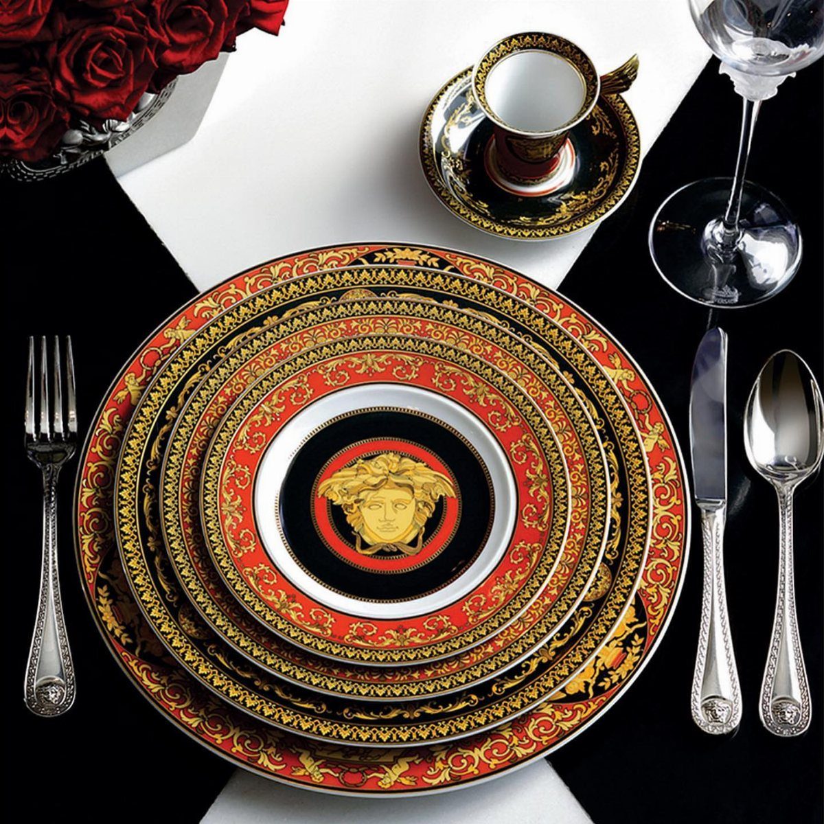 Fancy Dinnerware Set Ideas for 2026 Tables (28 Styles) 4 Medusa Red dinnerware set with gold ornate patterns and a central gold head emblem.