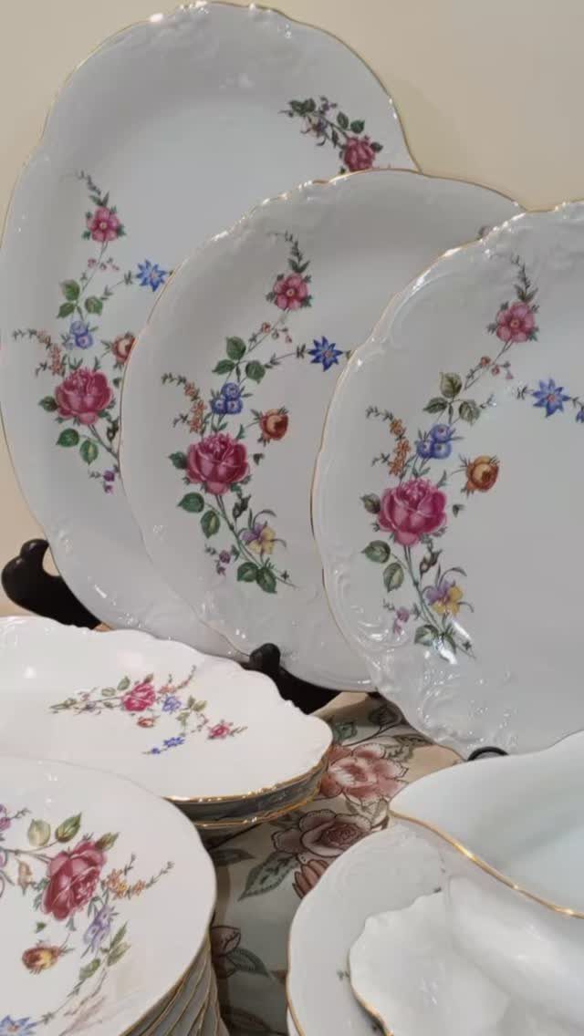 Fancy Dinnerware Set Ideas for 2026 Tables (28 Styles) 22 White porcelain dinnerware set with gold rims and colorful floral rose patterns.