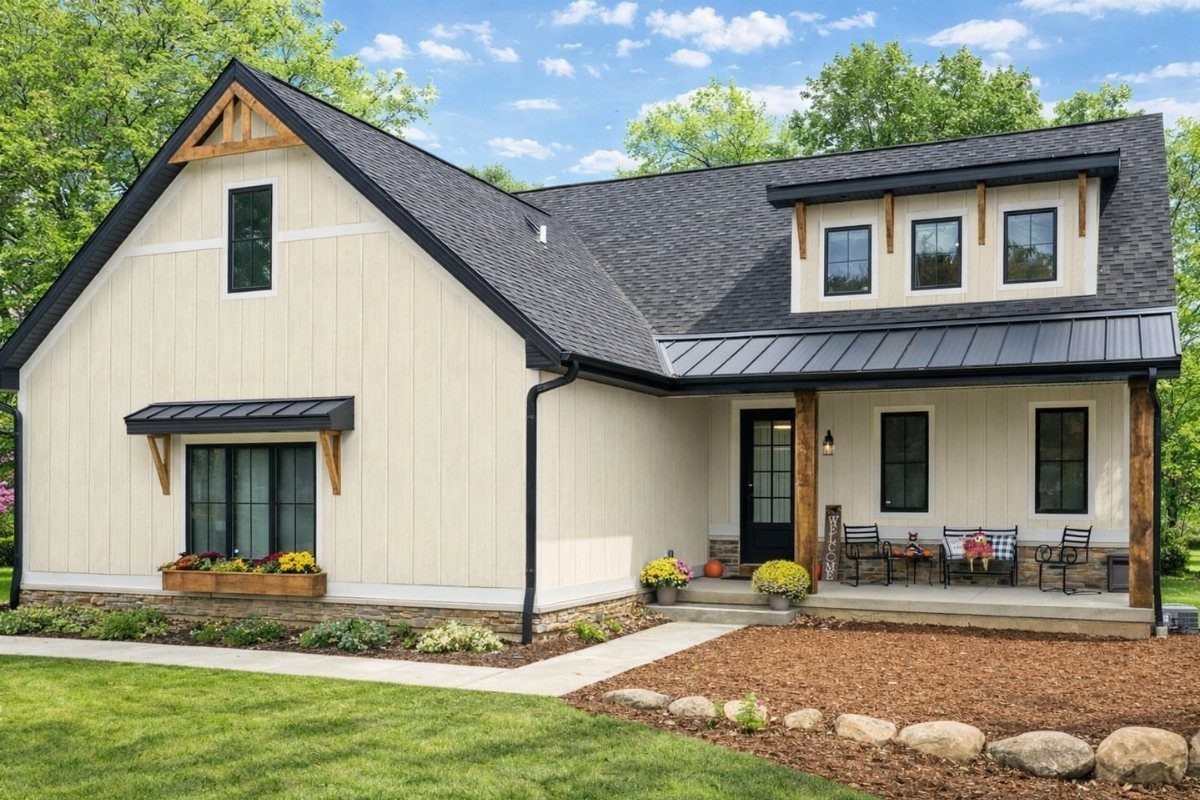 Modern cream house with vertical board and batten siding and dark gray roof.