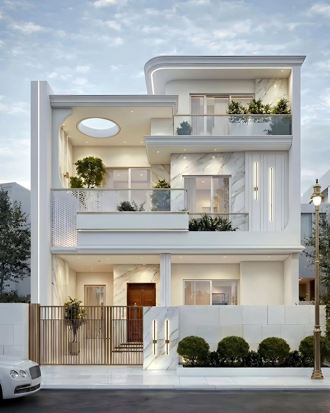 Modern three-story white house with glass balconies and marble exterior walls.