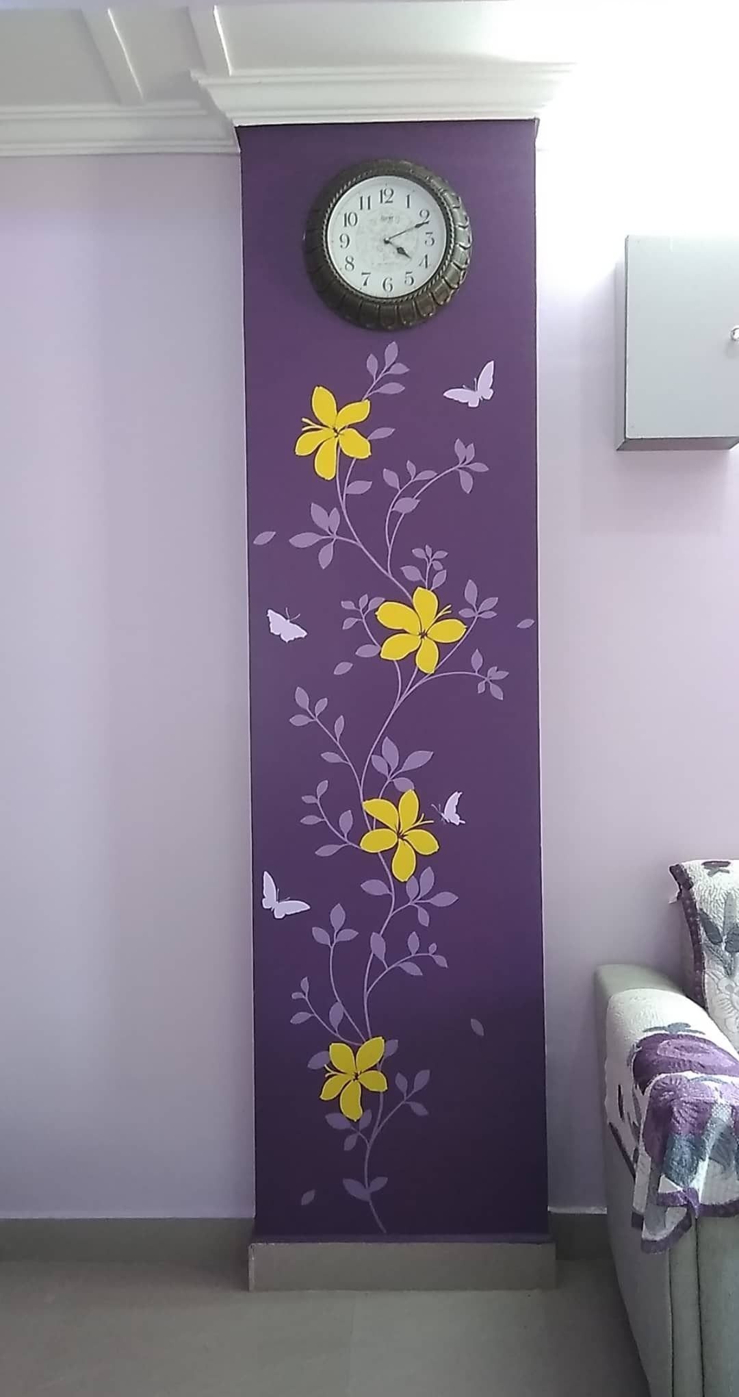 Indian Room Decor: 37 Ideas From Textiles to Wall Hangings 23 Yellow floral and white butterfly wall decals on a purple painted wall section.