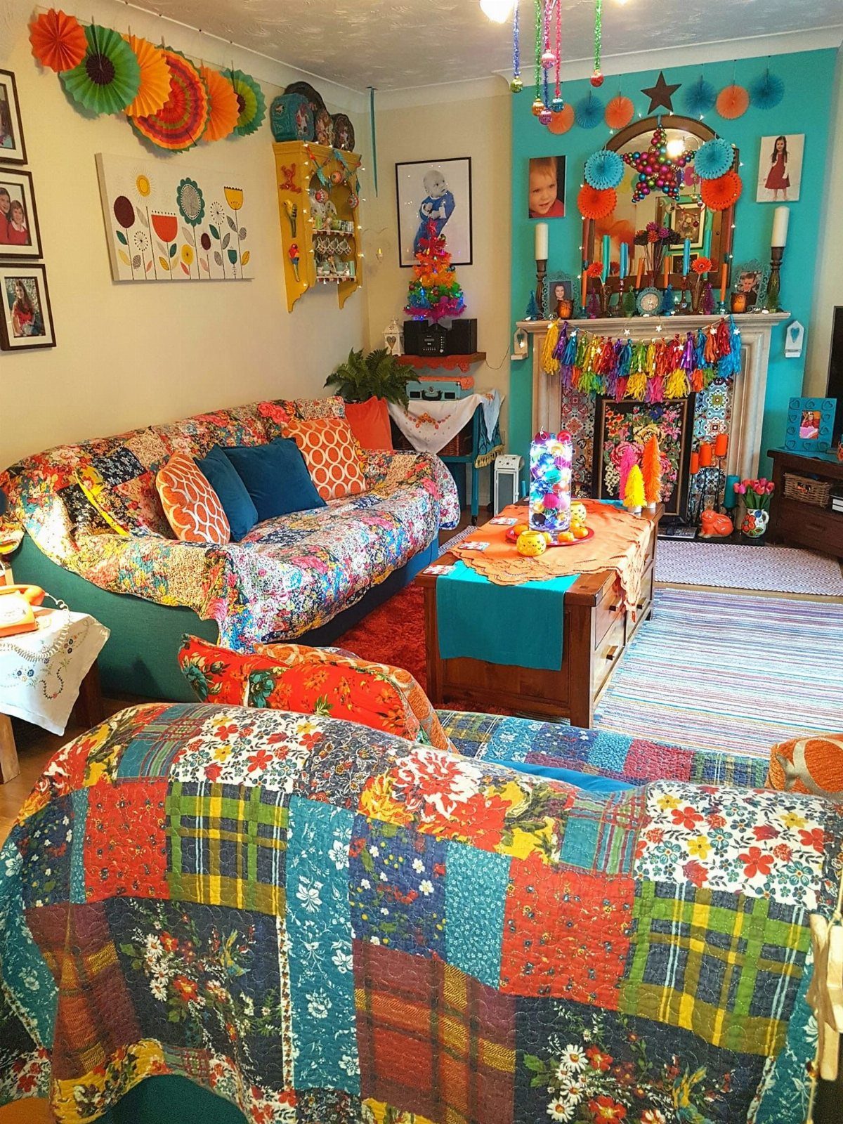 Indian Room Decor: 37 Ideas From Textiles to Wall Hangings 34 Colorful wall fans and eclectic textiles decorating a vibrant, bohemian style living room.