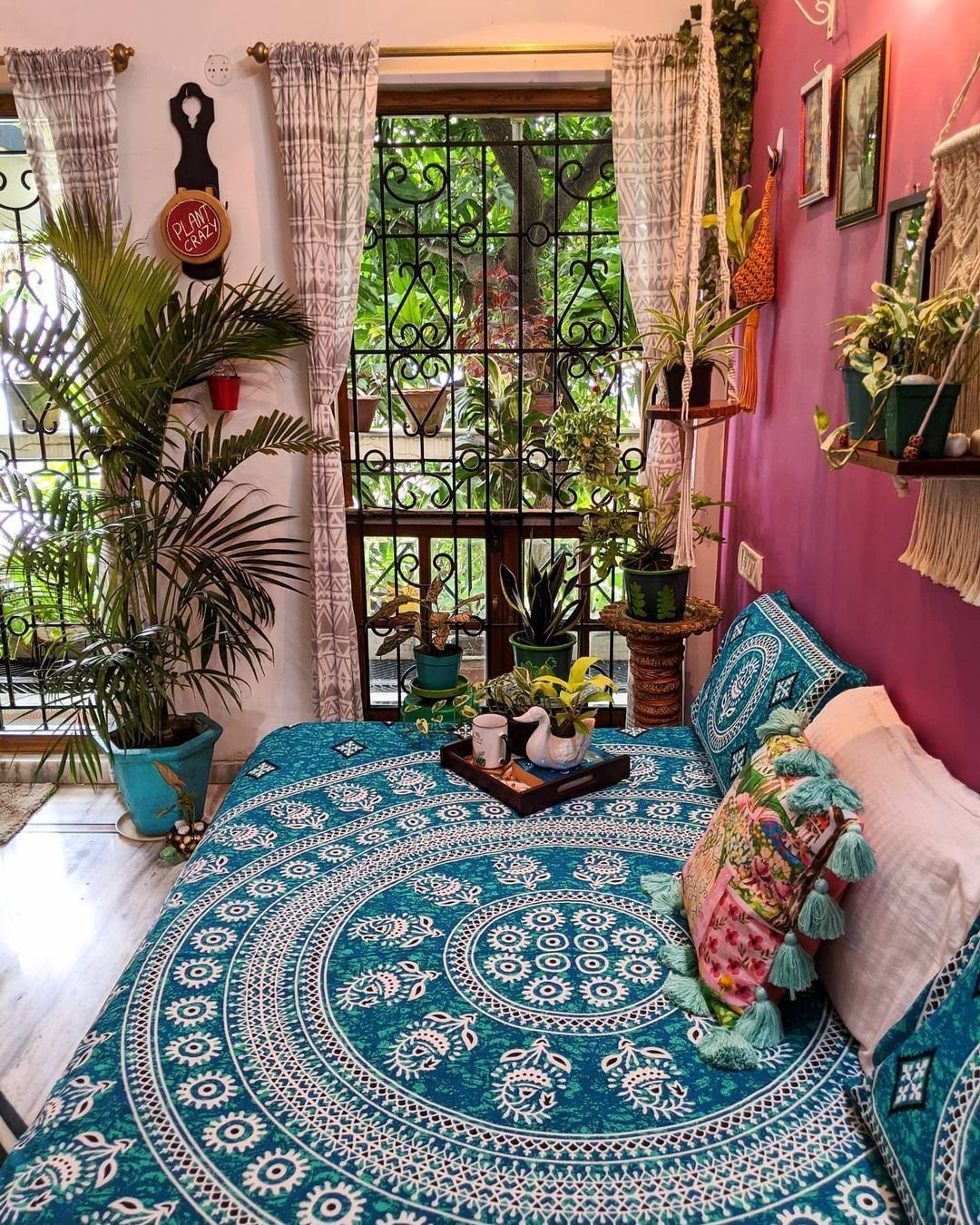 Indian Room Decor: 37 Ideas From Textiles to Wall Hangings 4 Potted indoor plants and a large palm in a colorful Indian bedroom.