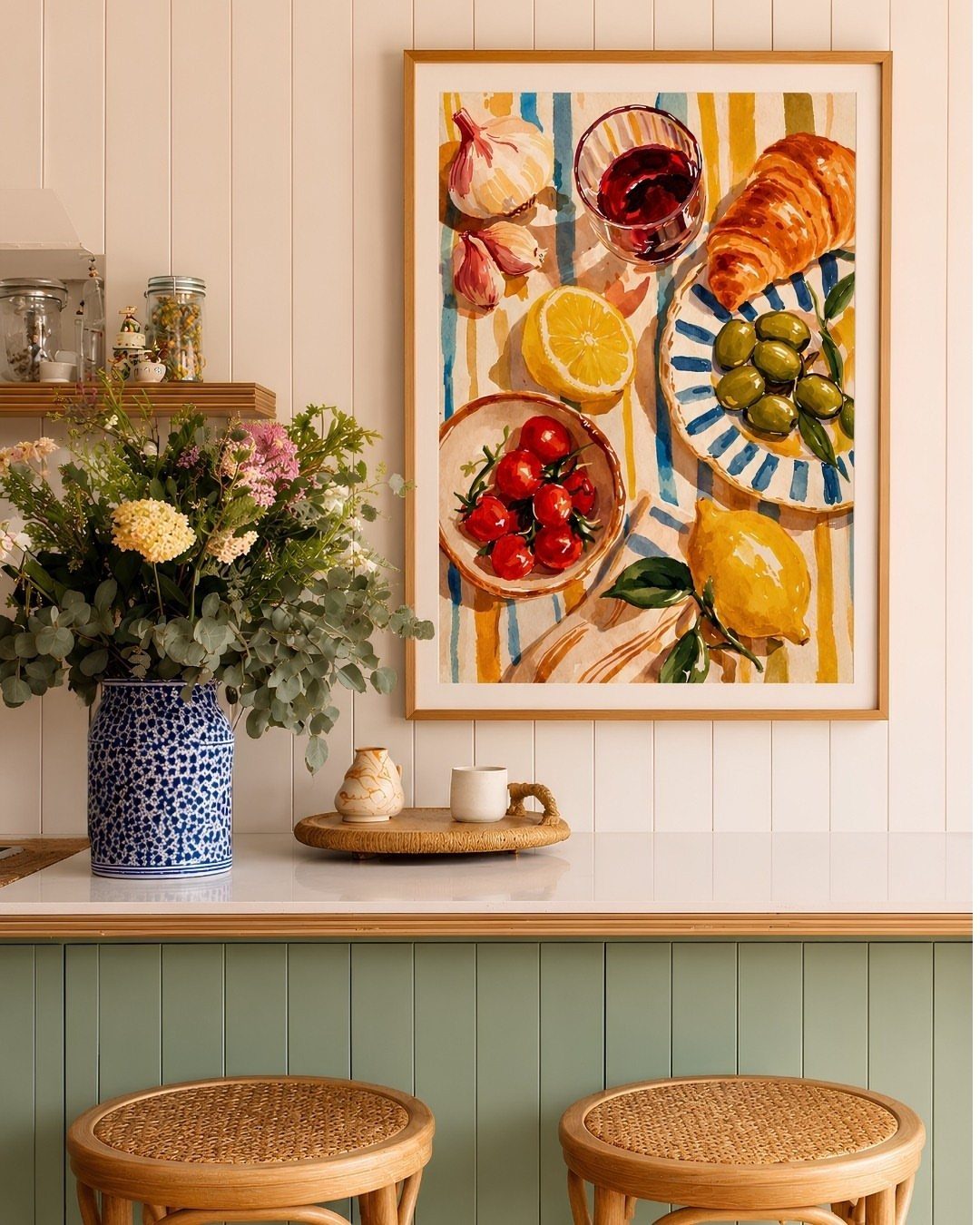 14 Kitchen Tabletop Decor Ideas to Style Your Counters 9 Blue patterned vase with fresh colorful flowers on a white kitchen countertop.