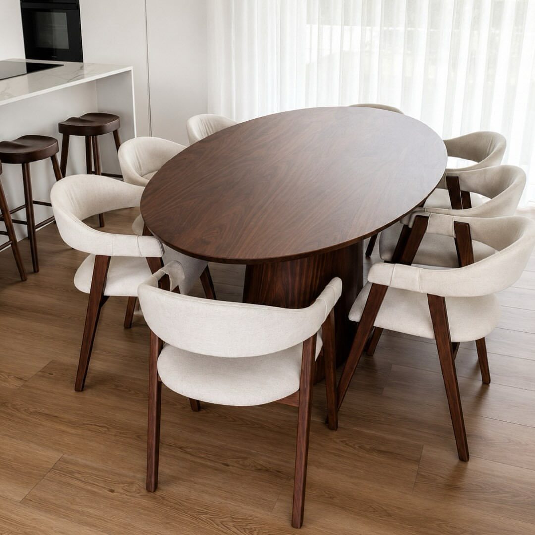 5 Modular Kitchen Table Designs for Flexible Dining Areas 5 Oval walnut wood dining table with six white upholstered mid-century modern chairs.