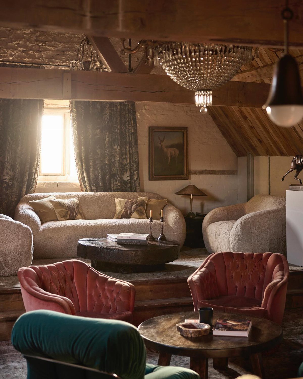 Oak Living Room Ideas: 9 Looks for Floors, Beams, Trim 9 Cozy living room with exposed oak beams, velvet armchairs, and a crystal chandelier.