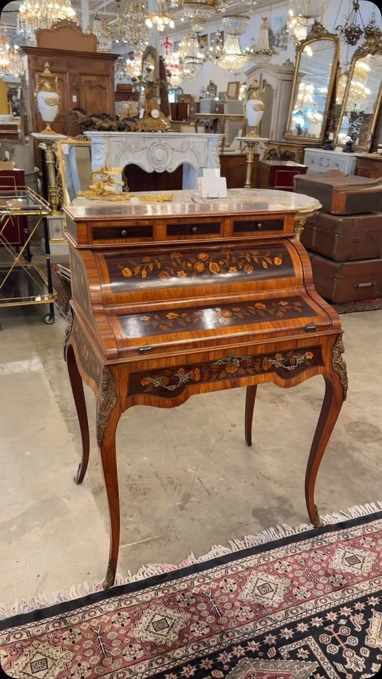 Antique French Provincial secretary desk with floral marquetry and curved cabriole legs.