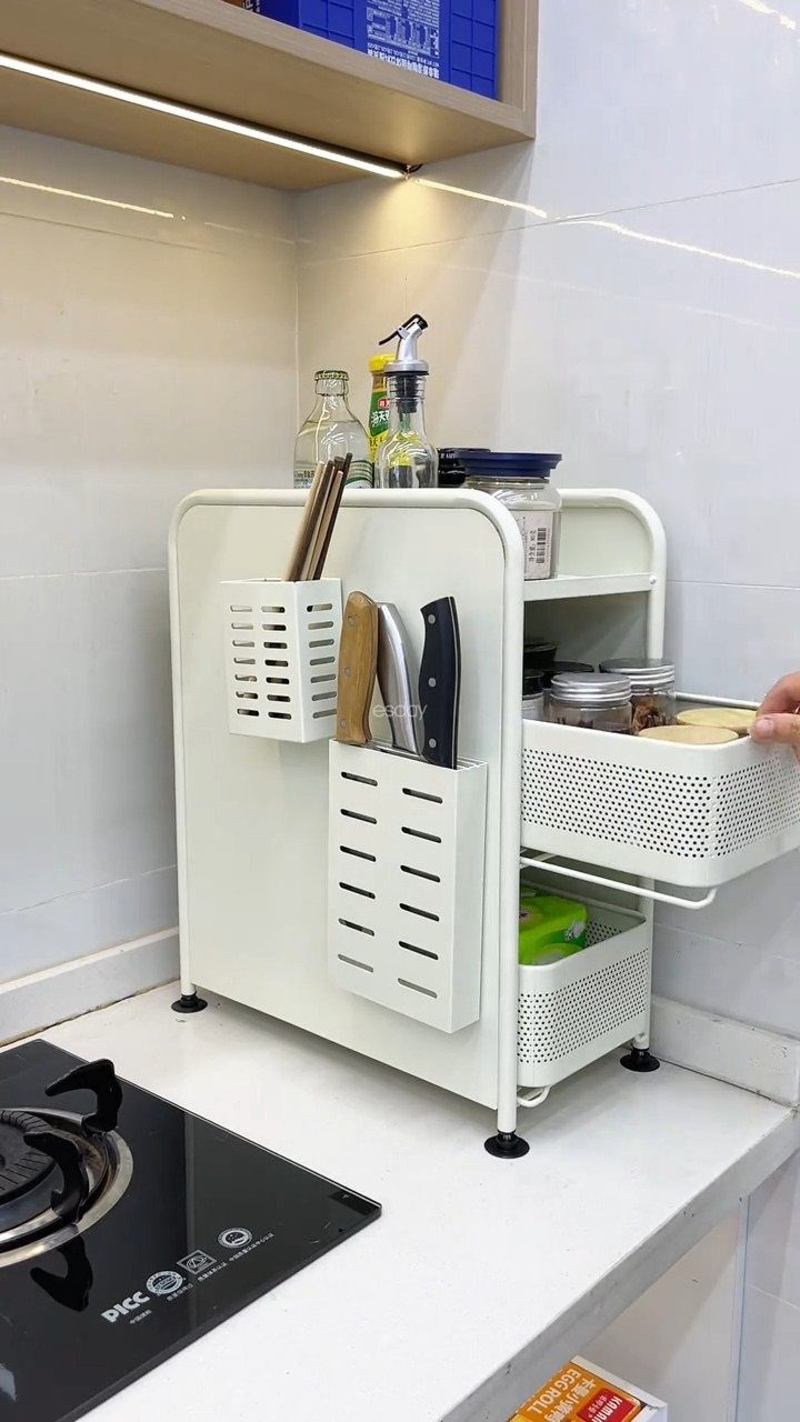 Pull Out Counter Ideas: 8 Ways to Add Kitchen Work Space 4 White metal kitchen countertop organizer with pull-out mesh drawers and knife holders.