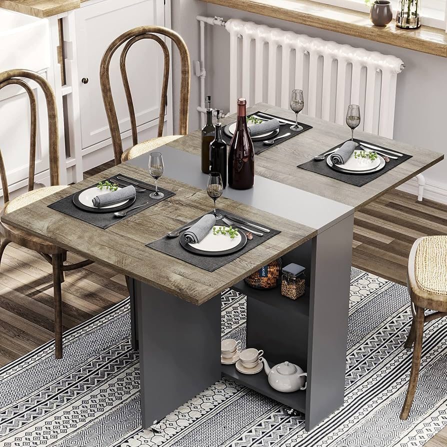 Wooden dining table with integrated storage shelves and a set table on a rug.
