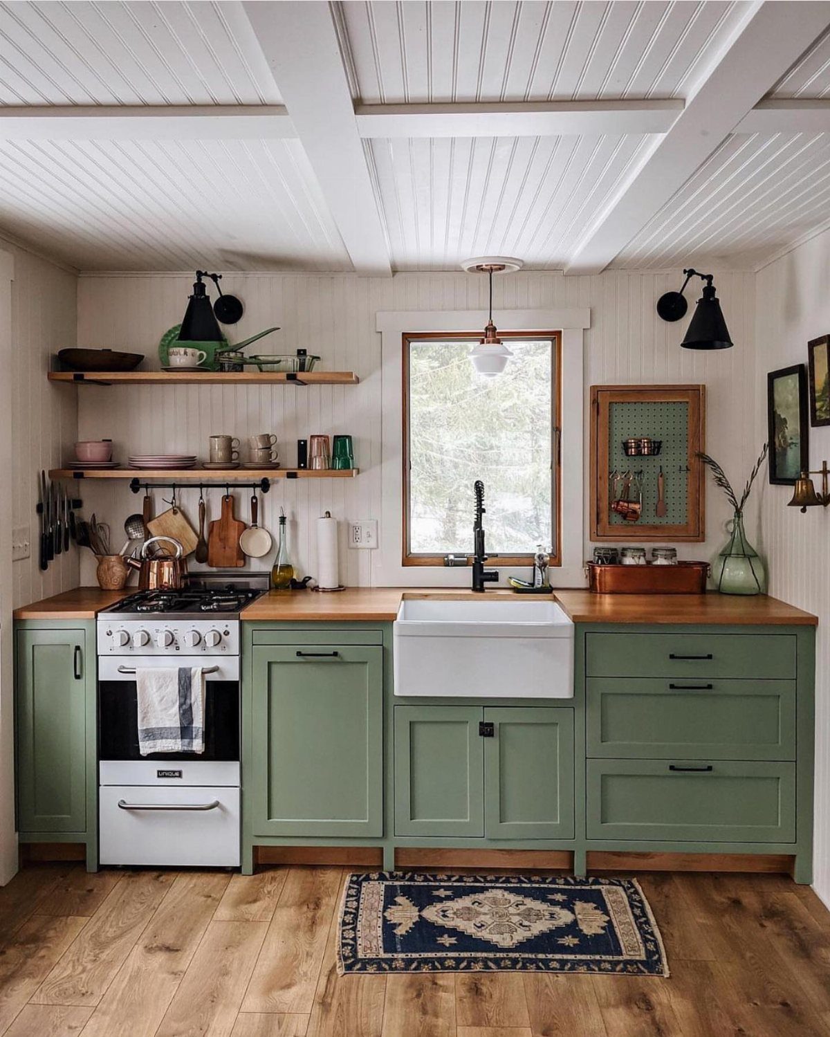 Tiny House Layout Ideas: 27 Smart Ways to Maximize Space 10 Sage green single-wall kitchen with wooden countertops, white farmhouse sink, and open shelving.