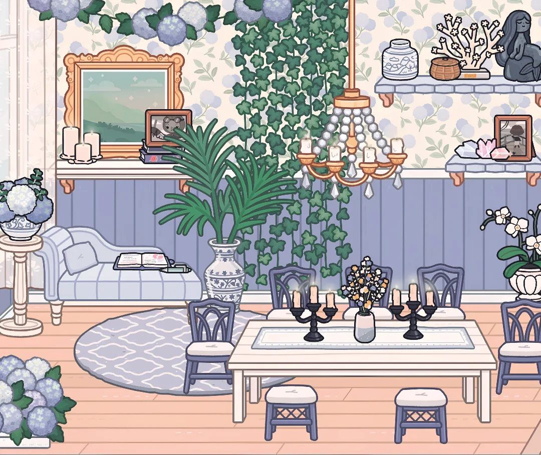 Toca Boca House Ideas: Coastal Villa Living Room with 8 Picks 9 Coastal living room with blue sofa, white dining table, and large potted palm plant.