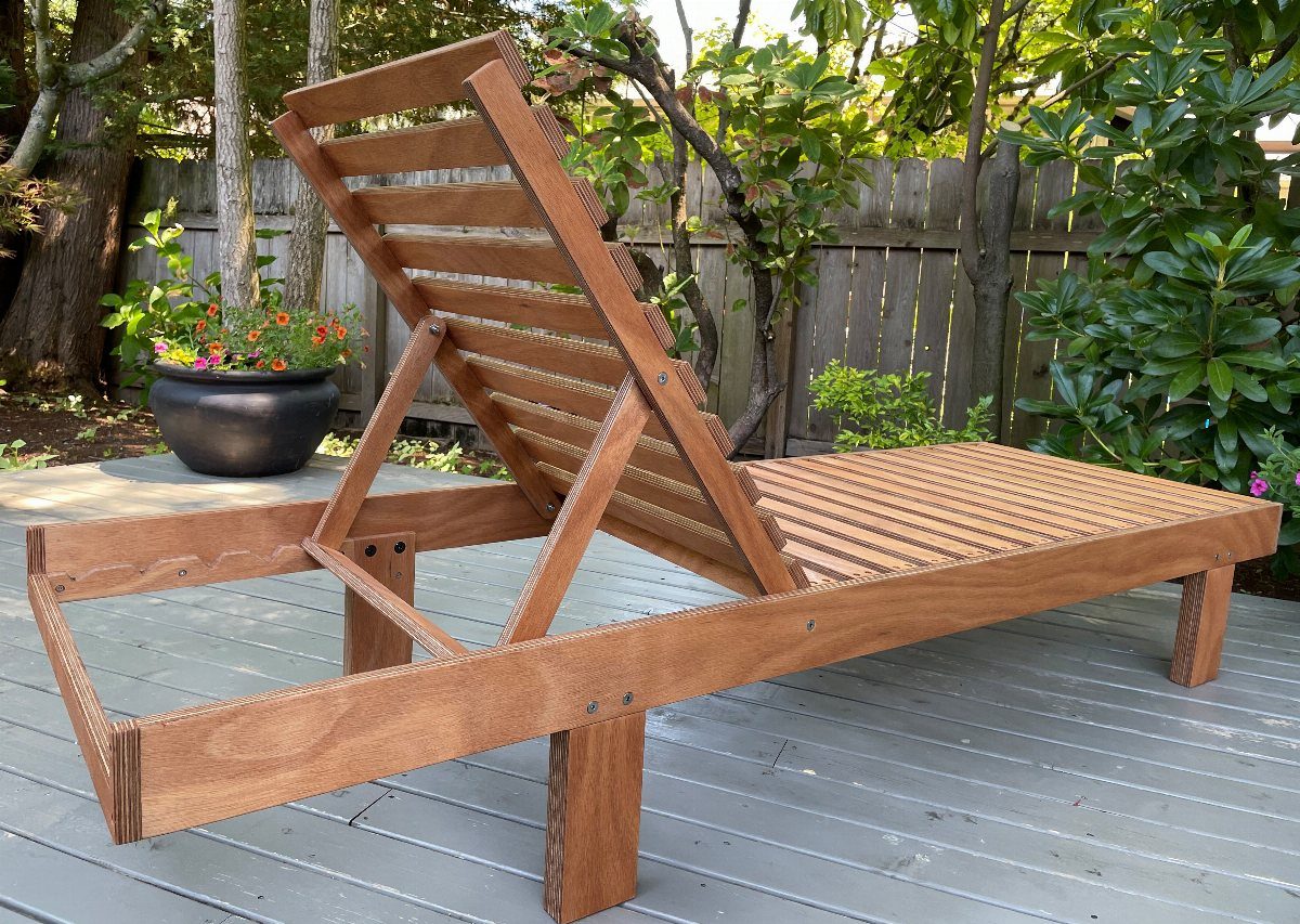 Wood Lounge Chair Ideas: 28 Styles from Teak to Mid-Century 17 Wooden lounge chair with adjustable backrest on a gray outdoor deck near greenery