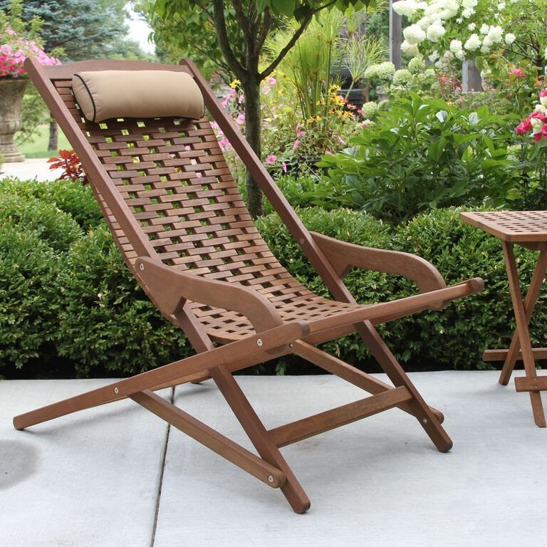 Wood Lounge Chair Ideas: 28 Styles from Teak to Mid-Century 3 Brown wooden reclining lounge chair with woven slats and tan pillow on a patio