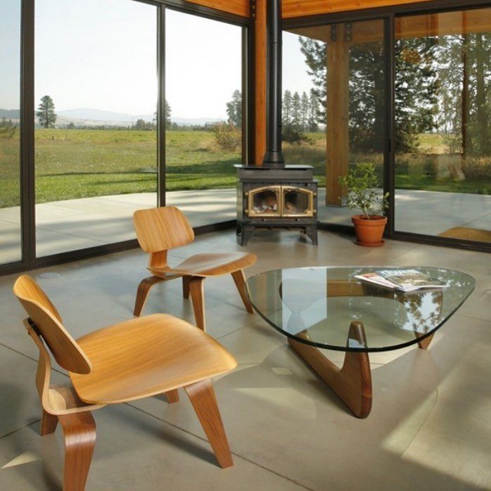 Wood Lounge Chair Ideas: 28 Styles from Teak to Mid-Century 8 Two curved plywood lounge chairs and a glass coffee table in a modern room.