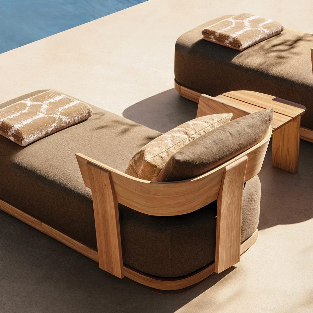 Wood Lounge Chair Ideas: 28 Styles from Teak to Mid-Century 2 Two wooden patio chaise lounges with brown cushions beside a swimming pool.