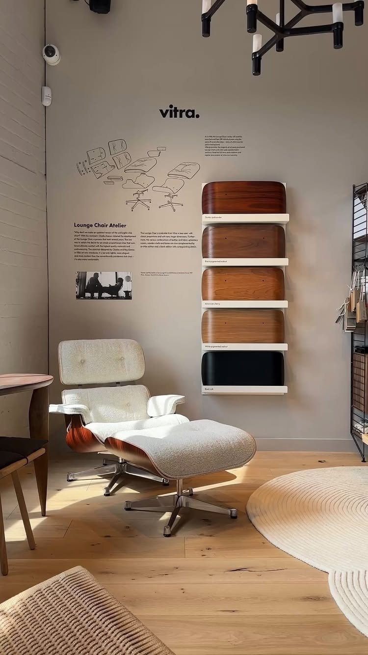 Wood Lounge Chair Ideas: 28 Styles from Teak to Mid-Century 23 White bouclé lounge chair and ottoman with curved wood frame in minimalist room.